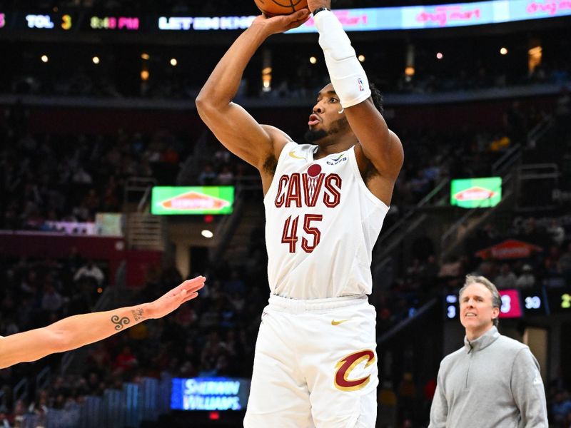 CLEVELAND, OHIO - DECEMBER 13: Donovan Mitchell #45 of the Cleveland Cavaliers shoots during the third quarter against the Washington Wizards at Rocket Mortgage Fieldhouse on December 13, 2024 in Cleveland, Ohio. The Cavaliers defeated the Wizards 115-105. NOTE TO USER: User expressly acknowledges and agrees that, by downloading and or using this photograph, User is consenting to the terms and conditions of the Getty Images License Agreement. (Photo by Jason Miller/Getty Images)