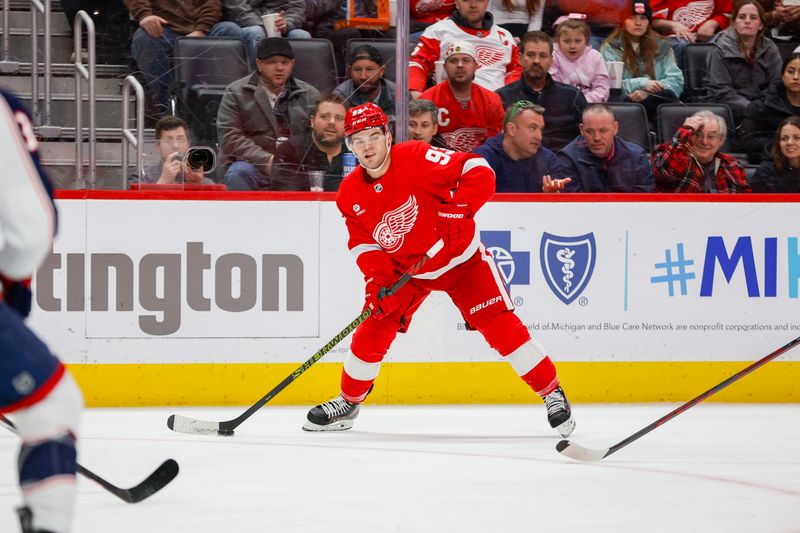 Mar 19, 2024; Detroit, Michigan, USA; Detroit Red Wings right wing Alex DeBrincat (93) handles the puck during the third period of the game against the Columbus Blue Jackets at Little Caesars Arena. Mandatory Credit: Brian Bradshaw Sevald-USA TODAY Sports