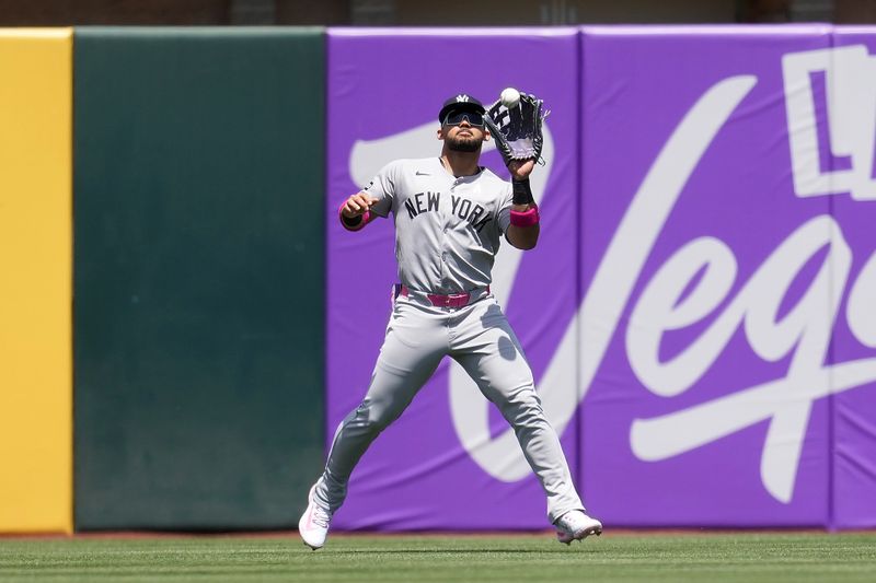 May 11, 2025; West Sacramento, California, USA; New York Yankees left fielder Jasson Dominguez (24) catches a fly ball against the Athletics in the first inning at Sutter Health Park. Mandatory Credit: Cary Edmondson-Imagn Images