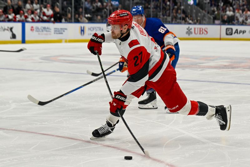 Apr 14, 2026; Elmont, New York, USA; Carolina Hurricanes left wing Nikolaj Ehlers (27) attempts a shot against the New York Islanders during the third period at UBS Arena. Mandatory Credit: Dennis Schneidler-Imagn Images Apr 14, 2026; Elmont, New York, USA; Carolina Hurricanes left wing Nikolaj Ehlers (27) attempts a shot against the New York Islanders during the third period at UBS Arena. Mandatory Credit: Dennis Schneidler-Imagn Images