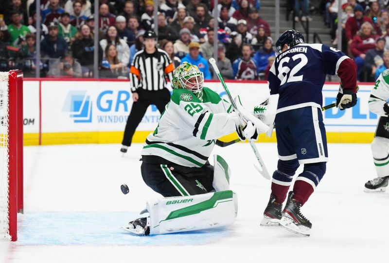 Apr 7, 2024; Denver, Colorado, USA; Dallas Stars goaltender Jake Oettinger (29) makes a save on Colorado Avalanche left wing Artturi Lehkonen (62) in the second period at Ball Arena. Mandatory Credit: Ron Chenoy-USA TODAY Sports