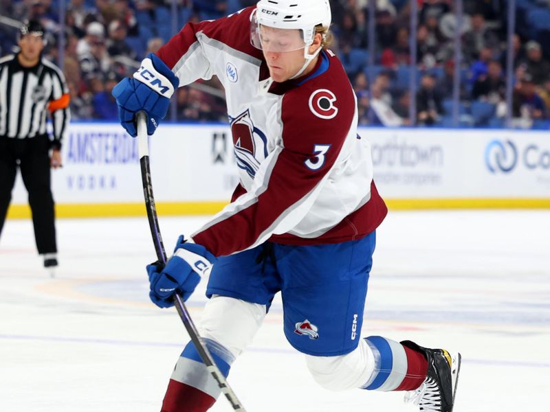 Dec 3, 2024; Buffalo, New York, USA;  Colorado Avalanche defenseman John Ludvig (3) takes a shot on goal during the first period against the Buffalo Sabres at KeyBank Center. Mandatory Credit: Timothy T. Ludwig-Imagn Images