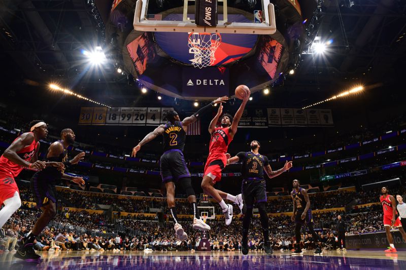 LOS ANGELES, CA - JANUARY 9:  Thaddeus Young #21 of the Toronto Raptors drives to the basket during the game against the Los Angeles Lakers on January 9, 2024 at Crypto.Com Arena in Los Angeles, California. NOTE TO USER: User expressly acknowledges and agrees that, by downloading and/or using this Photograph, user is consenting to the terms and conditions of the Getty Images License Agreement. Mandatory Copyright Notice: Copyright 2024 NBAE (Photo by Adam Pantozzi/NBAE via Getty Images)