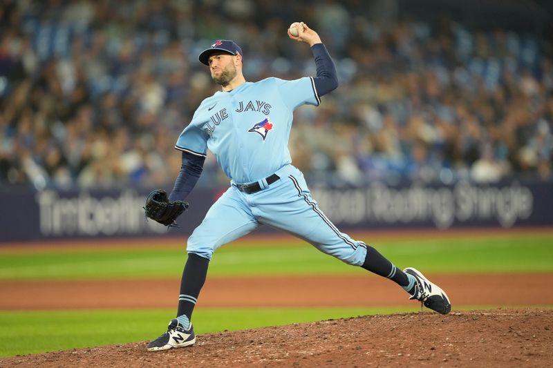 Sep 28, 2023; Toronto, Ontario, CAN; Toronto Blue Jays pitcher Tim Mayza (58) pitches to the New York Yankees during the ninth inning at Rogers Centre. Mandatory Credit: John E. Sokolowski-USA TODAY Sports