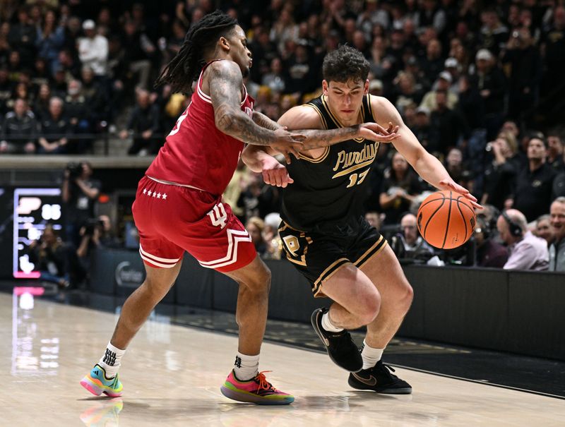 Feb 20, 2026; West Lafayette, Indiana, USA; Purdue Boilermakers guard Omer Mayer (17) drives around Indiana Hoosiers guard Lamar Wilkerson (3) during the second half at Mackey Arena. Mandatory Credit: Marc Lebryk-Imagn Images