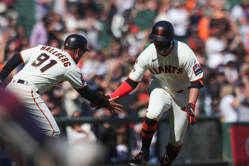 Sep 13, 2023; San Francisco, California, USA; San Francisco Giants third baseman J.D. Davis (7) is congratulated after hitting a three run home run during the eighth inning against the Cleveland Guardians at Oracle Park. Mandatory Credit: Sergio Estrada-USA TODAY Sports