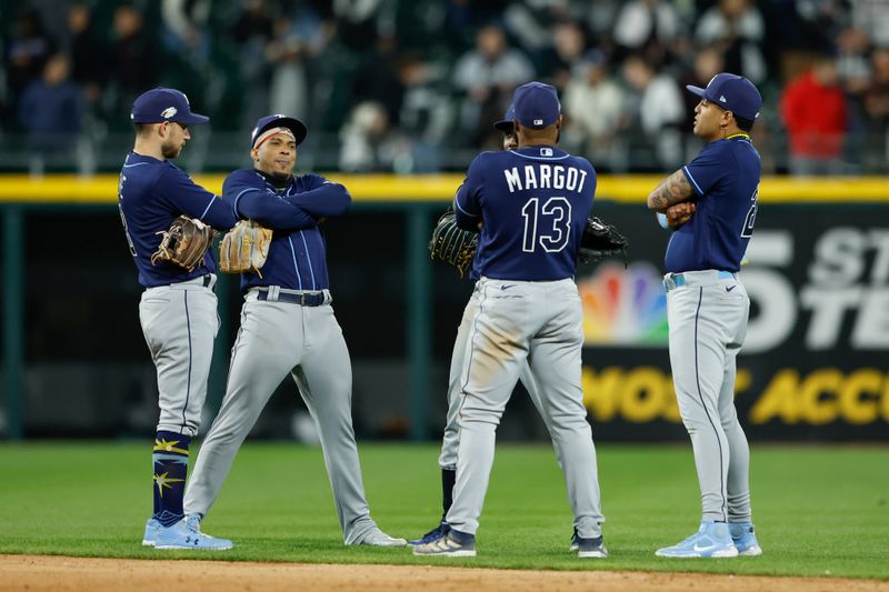 Apr 28, 2023; Chicago, Illinois, USA; Tampa Bay Rays players celebrate team's win against the Chicago White Sox during the ninth inning at Guaranteed Rate Field. Mandatory Credit: Kamil Krzaczynski-USA TODAY Sports