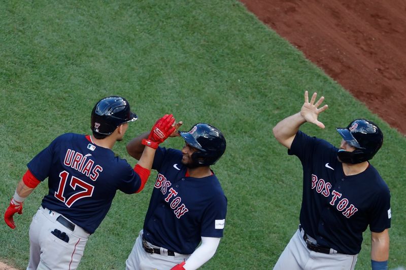 Aug 17, 2023; Washington, District of Columbia, USA; Boston Red Sox third baseman Luis Urias (17) celebrates with Boston Red Sox shortstop Pablo Reyes (19) and Red Sox center fielder Adam Duvall (18) after hitting a grand slam against the Washington Nationals during the seventh inning at Nationals Park. Mandatory Credit: Geoff Burke-USA TODAY Sports