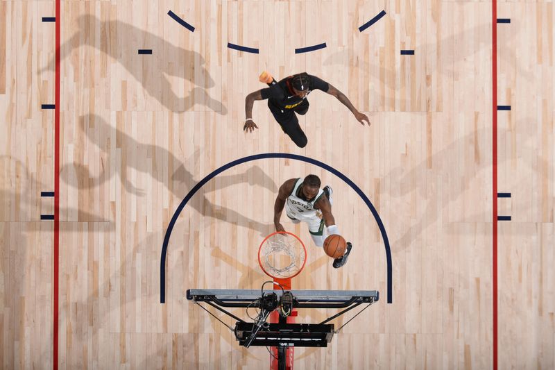 DENVER, CO - MARCH 7: Jaylen Brown #7 of the Boston Celtics drives to the basket during the game against the Denver Nuggets on March 7, 2024 at the Ball Arena in Denver, Colorado. NOTE TO USER: User expressly acknowledges and agrees that, by downloading and/or using this Photograph, user is consenting to the terms and conditions of the Getty Images License Agreement. Mandatory Copyright Notice: Copyright 2024 NBAE (Photo by Bart Young/NBAE via Getty Images)