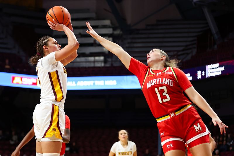 Jan 3, 2024; Minneapolis, Minnesota, USA; Minnesota Golden Gophers guard Amaya Battle (3) shoots against Maryland Terrapins guard Faith Masonius (13) during the first half at Williams Arena. Mandatory Credit: Matt Krohn-USA TODAY Sports