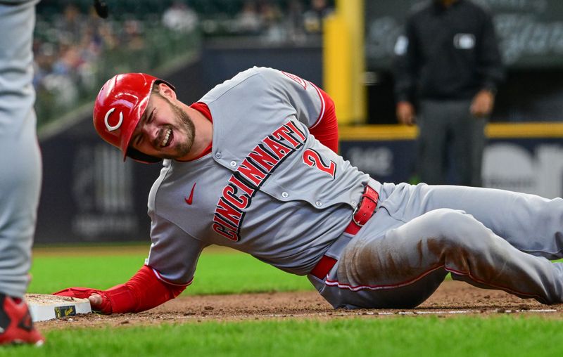 Apr 6, 2025; Milwaukee, Wisconsin, USA;  Cincinnati Reds left fielder Gavin Lux (2) reacts after being hit in the back on a pickoff attempt in the fourth inning against the Milwaukee Brewers at American Family Field. Mandatory Credit: Benny Sieu-Imagn Images