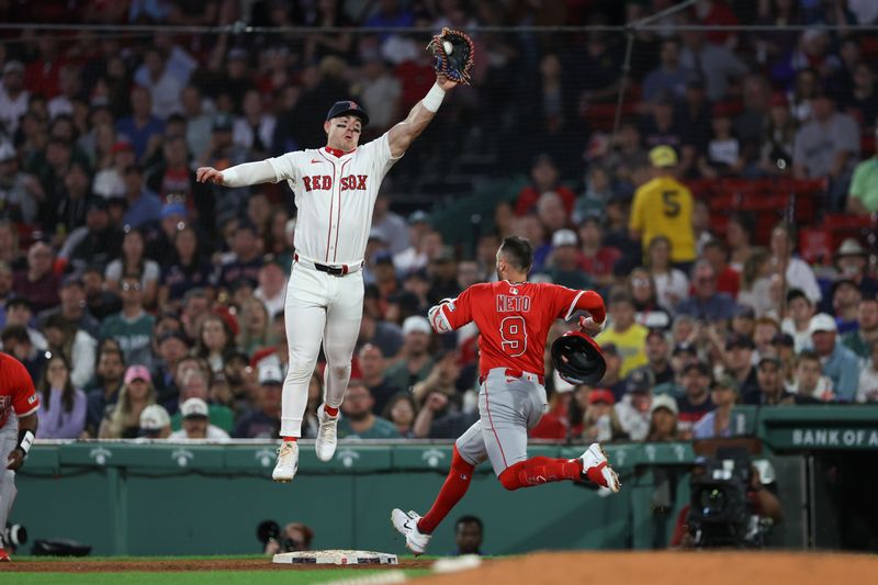 Jun 3, 2025; Boston, Massachusetts, USA; Los Angeles Angels shortstop Zachary Neto (9) beats a throw to Boston Red Sox first baseman Romy Gonzalez (23) during the fifth inning at Fenway Park. Mandatory Credit: Paul Rutherford-Imagn Images