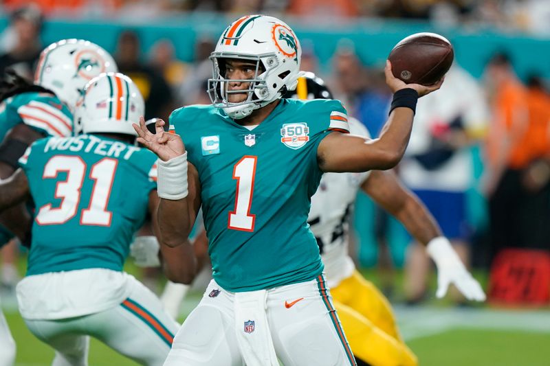 Miami Dolphins quarterback Tua Tagovailoa (1) aims a pass during the first half of an NFL football game against the Pittsburgh Steelers, Sunday, Oct. 23, 2022, in Miami Gardens, Fla. (AP Photo/Wilfredo Lee )