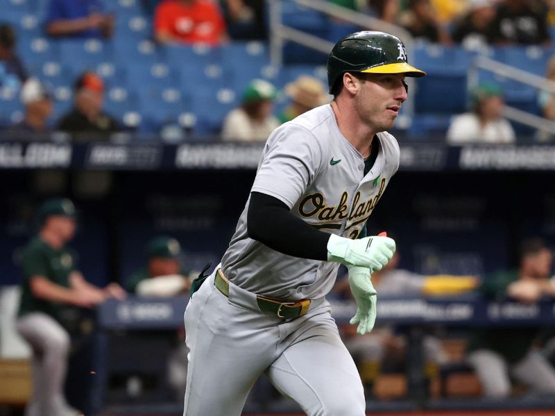 May 30, 2024; St. Petersburg, Florida, USA; Oakland Athletics outfielder Brent Rooker (25) hits an RBI double against the Tampa Bay Rays during the third inning at Tropicana Field. Mandatory Credit: Kim Klement Neitzel-USA TODAY Sports