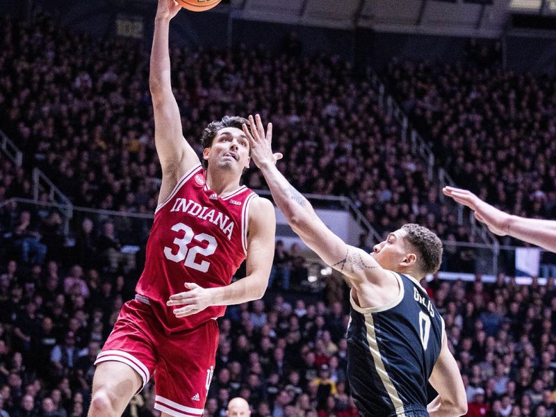 Feb 10, 2024; West Lafayette, Indiana, USA; Indiana Hoosiers guard Trey Galloway (32) shoots the ball while Purdue Boilermakers forward Mason Gillis (0) defends in the first half at Mackey Arena. Mandatory Credit: Trevor Ruszkowski-USA TODAY Sports