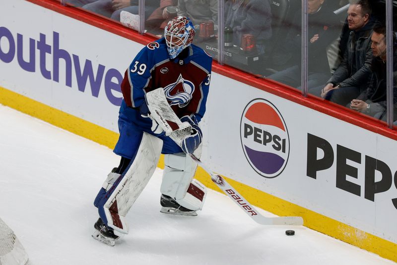 Feb 26, 2025; Denver, Colorado, USA; Colorado Avalanche goaltender Mackenzie Blackwood (39) plays the puck in the first period against the New Jersey Devils at Ball Arena. Mandatory Credit: Isaiah J. Downing-Imagn Images
