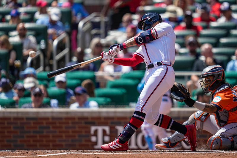 Apr 23, 2023; Cumberland, Georgia, USA; Atlanta Braves left fielder Kevin Pillar (17) hits a home run against the Houston Astros during the fifth inning at Truist Park. Mandatory Credit: Dale Zanine-USA TODAY Sports