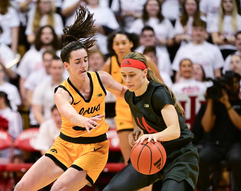 Feb 22, 2024; Bloomington, Indiana, USA; Iowa Hawkeyes guard Caitlin Clark (22) defends against Indiana Hoosiers guard Sara Scalia (14) during the second quarter at Simon Skjodt Assembly Hall. Mandatory Credit: Marc Lebryk-USA TODAY Sports