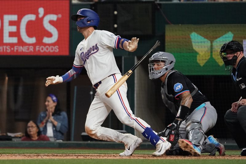 Sep 20, 2025; Arlington, Texas, USA; Texas Rangers catcher Kyle Higashioka (11) reacts after hitting a solo home run during the ninth inning against the Miami Marlins at Globe Life Field. Mandatory Credit: Raymond Carlin III-Imagn Images