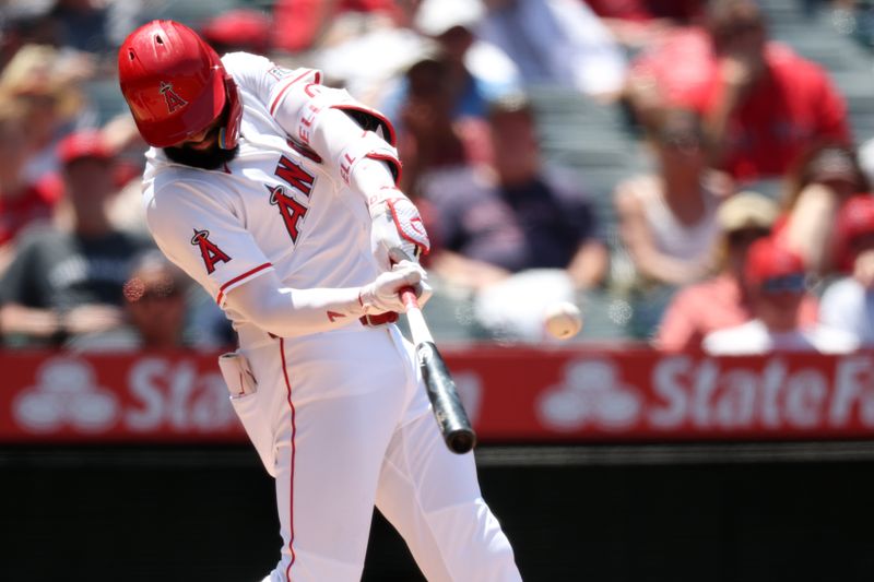 Jun 25, 2025; Anaheim, California, USA;  Los Angeles Angels center fielder Jo Adell (7) hits a home run during the fourth inning against the Boston Red Sox at Angel Stadium. Mandatory Credit: Kiyoshi Mio-Imagn Images