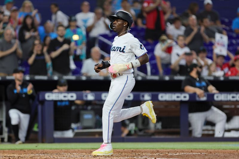 Sep 24, 2023; Miami, Florida, USA; Miami Marlins center fielder Jazz Chisholm Jr. (2) scores against the Milwaukee Brewers during the third inning at loanDepot Park. Mandatory Credit: Sam Navarro-USA TODAY Sports