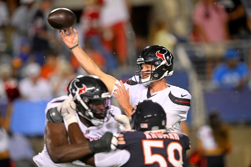 Houston Texans quarterback Tim Boyle, top right, throws a pass during the second half of an NFL exhibition Hall of Fame football game against the Chicago Bears, Thursday, Aug. 1, 2024, in Canton, Ohio. (AP Photo/David Richard)