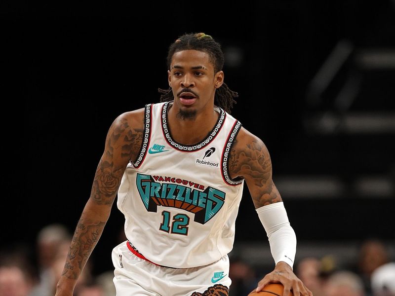 MEMPHIS, TENNESSEE - DECEMBER 01: Ja Morant #12 of the Memphis Grizzlies brings the ball up court during the first half against the Indiana Pacers at FedExForum on December 01, 2024 in Memphis, Tennessee. NOTE TO USER: User expressly acknowledges and agrees that, by downloading and or using this photograph, User is consenting to the terms and conditions of the Getty Images License Agreement. (Photo by Justin Ford/Getty Images)