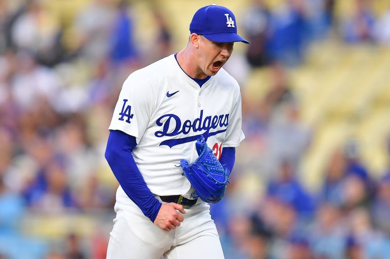 May 31, 2024; Los Angeles, California, USA; Los Angeles Dodgers pitcher Walker Buehler (21) reacts following the first inning against the Colorado Rockies at Dodger Stadium. Mandatory Credit: Gary A. Vasquez-USA TODAY Sports