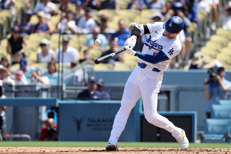 Sep 8, 2024; Los Angeles, California, USA;  Los Angeles Dodgers designated hitter Shohei Ohtani (17) hits a single during the third inning against the Cleveland Guardians at Dodger Stadium. Mandatory Credit: Kiyoshi Mio-Imagn Images