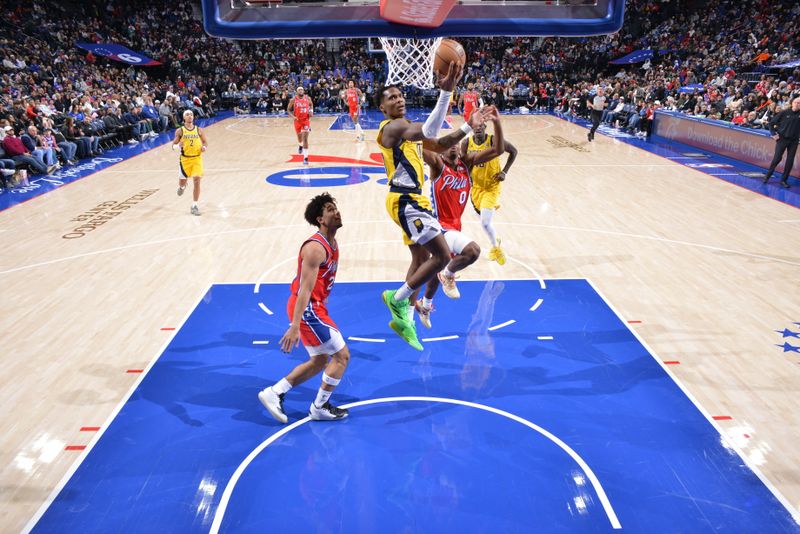 PHILADELPHIA, PA - DECEMBER 13: Bennedict Mathurin #00 of the Indiana Pacers drives to the basket during the game against the Philadelphia 76ers on December 13, 2024 at the Wells Fargo Center in Philadelphia, Pennsylvania NOTE TO USER: User expressly acknowledges and agrees that, by downloading and/or using this Photograph, user is consenting to the terms and conditions of the Getty Images License Agreement. Mandatory Copyright Notice: Copyright 2024 NBAE (Photo by Jesse D. Garrabrant/NBAE via Getty Images)