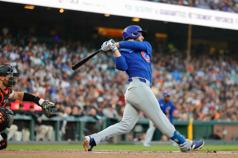 Jun 24, 2024; San Francisco, California, USA; Chicago Cubs first base Michael Busch (29) hits an RBI single during the third inning against the San Francisco Giants at Oracle Park. All Giants players wore the number 24 in honor of Giants former player Willie Mays. Mandatory Credit: Sergio Estrada-USA TODAY Sports