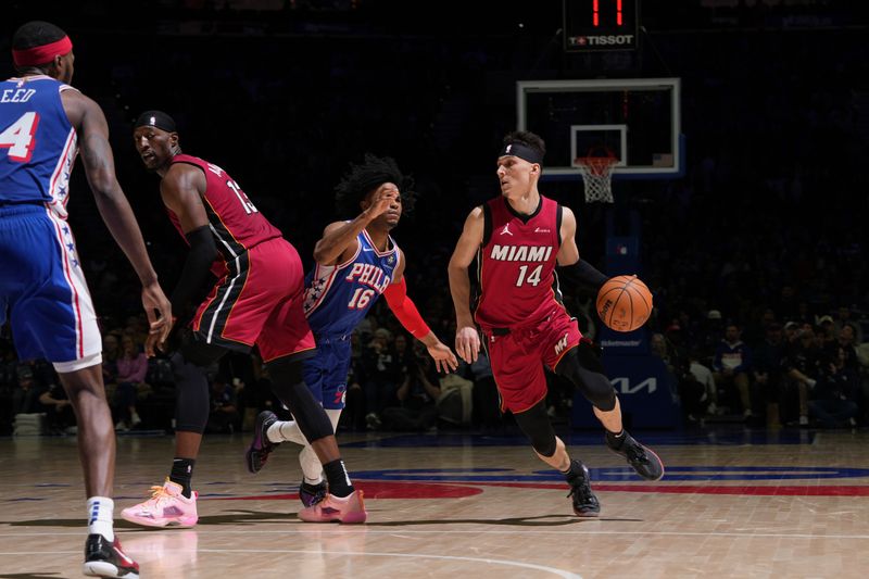 PHILADELPHIA, PA - FEBRUARY 14: Tyler Herro #14 of the Miami Heat dribbles the ball during the game against the Philadelphia 76ers on February 14, 2024 at the Wells Fargo Center in Philadelphia, Pennsylvania NOTE TO USER: User expressly acknowledges and agrees that, by downloading and/or using this Photograph, user is consenting to the terms and conditions of the Getty Images License Agreement. Mandatory Copyright Notice: Copyright 2024 NBAE (Photo by Jesse D. Garrabrant/NBAE via Getty Images)