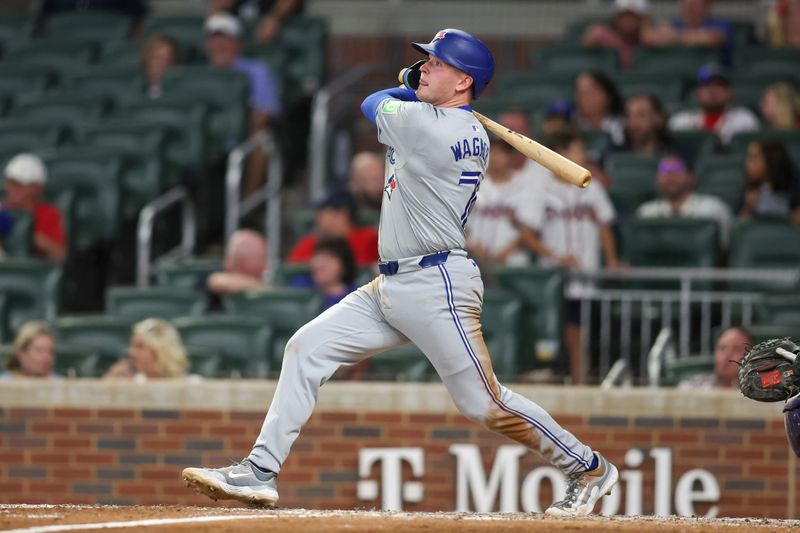 Sep 7, 2024; Atlanta, Georgia, USA; Toronto Blue Jays second baseman Will Wagner (7) hits an RBI single against the Atlanta Braves in the ninth inning at Truist Park. Mandatory Credit: Brett Davis-Imagn Images