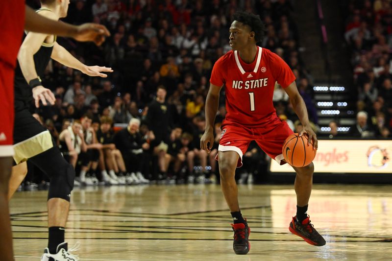 Jan 28, 2023; Winston-Salem, North Carolina, USA;  North Carolina State Wolfpack guard Jarkel Joiner (1) dribbles at the top of the key during the second half at Lawrence Joel Veterans Memorial Coliseum. Mandatory Credit: William Howard-USA TODAY Sports