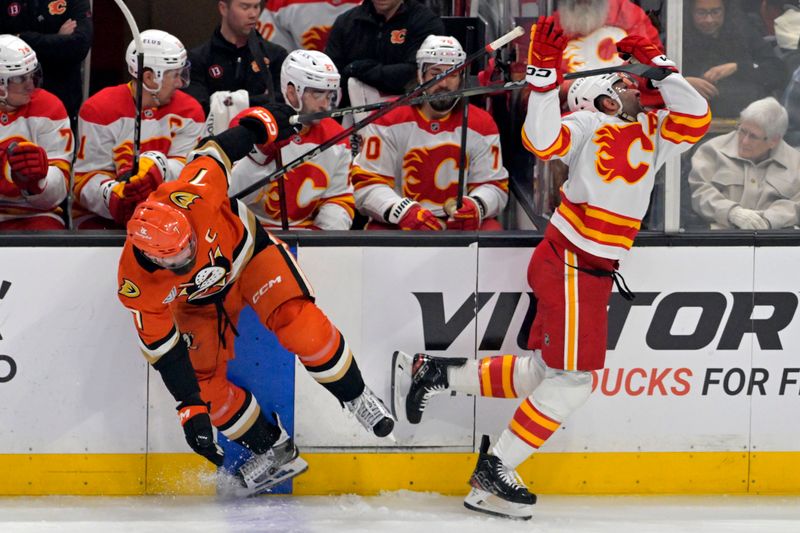 Apr 9, 2025; Anaheim, California, USA;  Calgary Flames center Nazem Kadri (91) reacts after a high stick from Anaheim Ducks defenseman Radko Gudas (7) during the second period at Honda Center. Mandatory Credit: Jayne Kamin-Oncea-Imagn Images