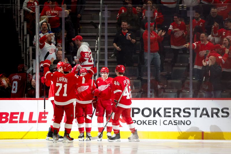 Feb 29, 2024; Detroit, Michigan, USA;  Detroit Red Wings right wing Patrick Kane (88) receives congratulations from teammates after scoring in the third period against the New York Islanders at Little Caesars Arena. Mandatory Credit: Rick Osentoski-USA TODAY Sports