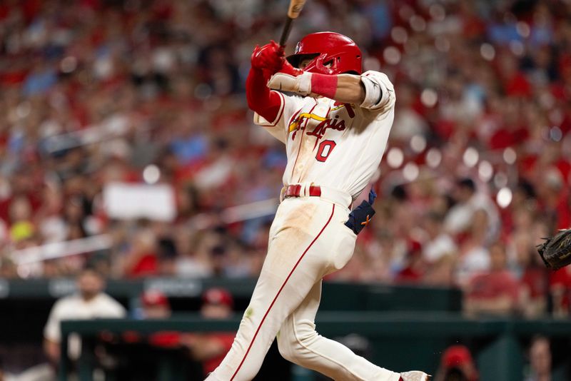 Sep 30, 2023; St. Louis, Missouri, USA; St. Louis Cardinals shortstop Masyn Winn (0) hits a single RBI in the eighth inning against the Cincinnati Reds at Busch Stadium. Mandatory Credit: Zach Dalin-USA TODAY Sports