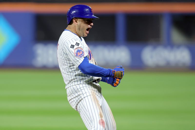 Sep 16, 2024; New York City, New York, USA; New York Mets second baseman Jose Iglesias (11) celebrates his game tying RBI single against the Washington Nationals during the eighth inning at Citi Field. Mandatory Credit: Brad Penner-Imagn Images