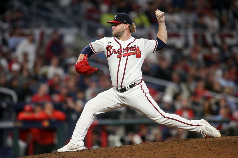 Oct 12, 2022; Atlanta, Georgia, USA; Atlanta Braves relief pitcher A.J. Minter (33) throws against the Philadelphia Phillies in the seventh inning during game two of the NLDS for the 2022 MLB Playoffs at Truist Park. Mandatory Credit: Brett Davis-USA TODAY Sports