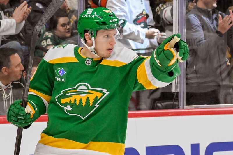 Nov 29, 2024; Saint Paul, Minnesota, USA;  Minnesota Wild forward Marco Rossi (23) celebrates his goal against the Chicago Blackhawks during the second period at Xcel Energy Center. Mandatory Credit: Nick Wosika-Imagn Images