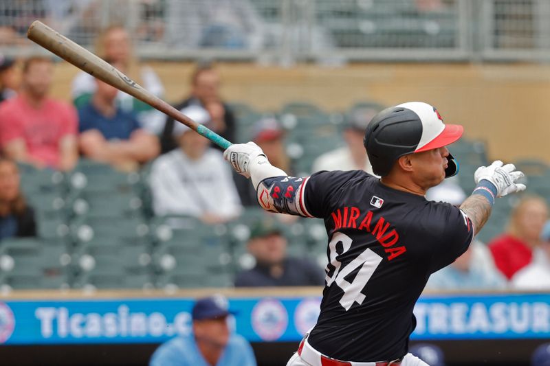 Jun 20, 2024; Minneapolis, Minnesota, USA; Minnesota Twins third baseman Jose Miranda (64) hits a three-run home run against the Tampa Bay Rays in the ninth inning at Target Field. Mandatory Credit: Bruce Kluckhohn-USA TODAY Sports