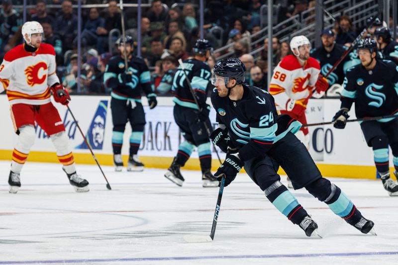 Oct 19, 2024; Seattle, Washington, USA; Seattle Kraken defenseman Jamie Oleksiak (24) skates against the Calgary Flames during the second period at Climate Pledge Arena. Mandatory Credit: Caean Couto-Imagn Images