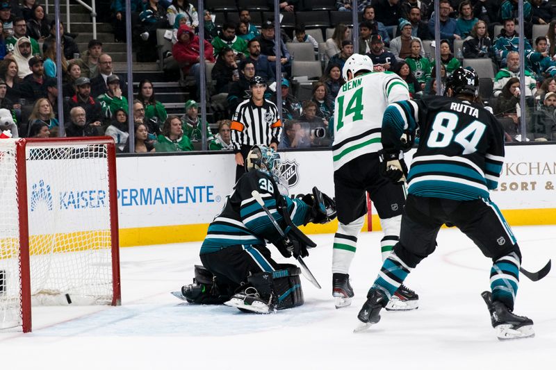 Mar 5, 2024; San Jose, California, USA; Dallas Stars left wing Jamie Benn (14) scores against San Jose Sharks goaltender Kaapo Kahkonen (36) during the first period at SAP Center at San Jose. Mandatory Credit: John Hefti-USA TODAY Sports