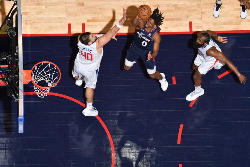 PHILADELPHIA, PA - MARCH 27: Tyrese Maxey #0 of the Philadelphia 76ers shoots the ball during the game against the LA Clippers on March 27, 2024 at the Wells Fargo Center in Philadelphia, Pennsylvania NOTE TO USER: User expressly acknowledges and agrees that, by downloading and/or using this Photograph, user is consenting to the terms and conditions of the Getty Images License Agreement. Mandatory Copyright Notice: Copyright 2024 NBAE (Photo by Jesse D. Garrabrant/NBAE via Getty Images)