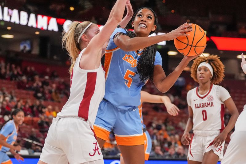 Mar 8, 2024; Greensville, SC, USA; Tennessee Lady Vols guard Kaiya Wynn (5) shoots against Alabama Crimson Tide guard Sarah Ashlee Barker (3) during the second half at Bon Secours Wellness Arena. Mandatory Credit: Jim Dedmon-USA TODAY Sports