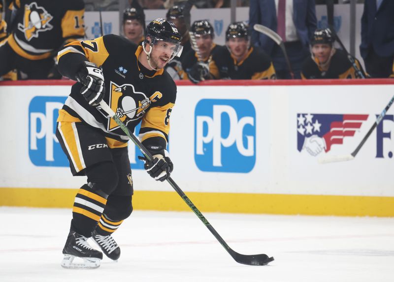 Mar 21, 2025; Pittsburgh, Pennsylvania, USA;  Pittsburgh Penguins center Sidney Crosby (87) moves the puck against the Columbus Blue Jackets during the first period at PPG Paints Arena. Mandatory Credit: Charles LeClaire-Imagn Images