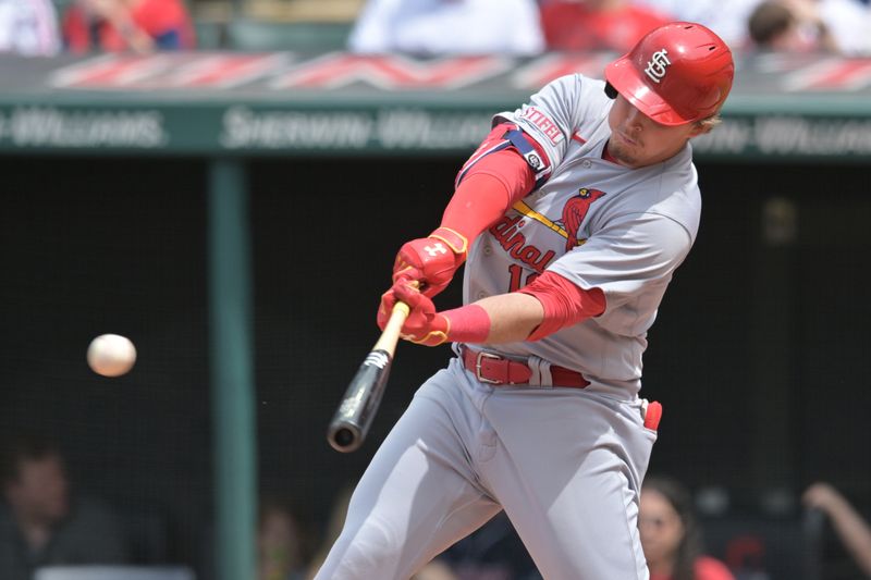 May 28, 2023; Cleveland, Ohio, USA; St. Louis Cardinals third baseman Nolan Gorman (16) hits a single during the fifth inning against the Cleveland Guardians at Progressive Field. Mandatory Credit: Ken Blaze-USA TODAY Sports