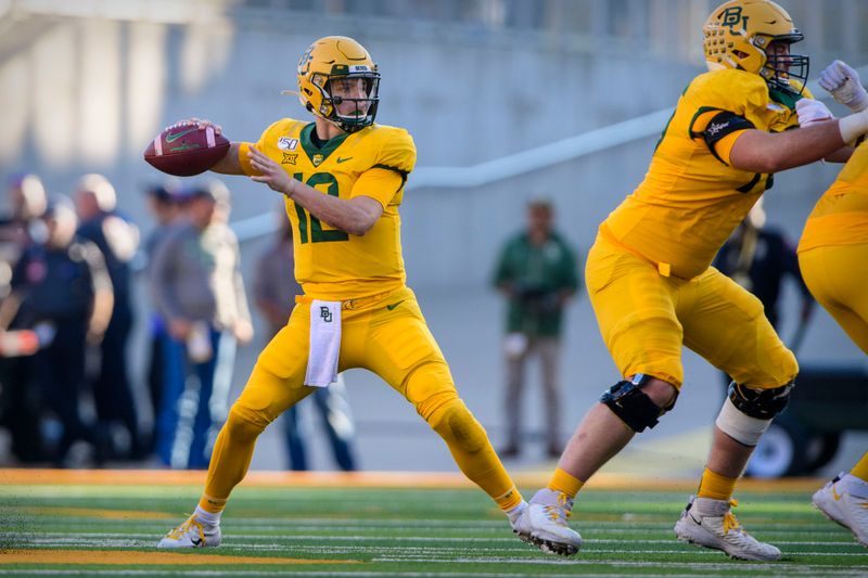 Nov 23, 2019; Waco, TX, USA; Baylor Bears quarterback Charlie Brewer (12) drops back to pass against the Texas Longhorns during the second quarter at McLane Stadium. Mandatory Credit: Jerome Miron-USA TODAY Sports