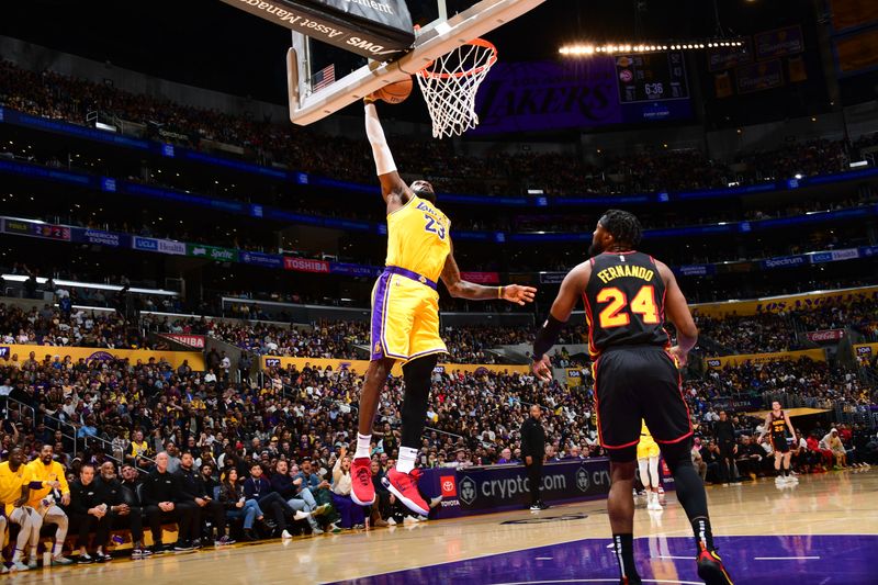 LOS ANGELES, CA - MARCH 18:  LeBron James #23 of the Los Angeles Lakers goes to the basket during the game on March 18, 2024 at Crypto.Com Arena in Los Angeles, California. NOTE TO USER: User expressly acknowledges and agrees that, by downloading and/or using this Photograph, user is consenting to the terms and conditions of the Getty Images License Agreement. Mandatory Copyright Notice: Copyright 2024 NBAE (Photo by Adam Pantozzi/NBAE via Getty Images)