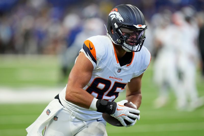 Denver Broncos tight end Lucas Krull (85) warms up before playing against the Indianapolis Colts in a preseason NFL football game, Sunday, Aug. 11, 2024, in Westfield, Ind. (AP Photo/AJ Mast)